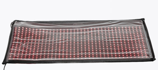 Rectangular LED mat with red and white lights on a clear background