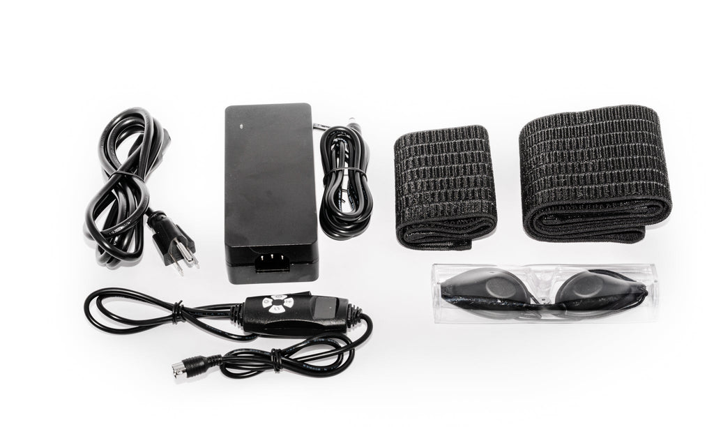 Set of black electronic components and accessories on a white background