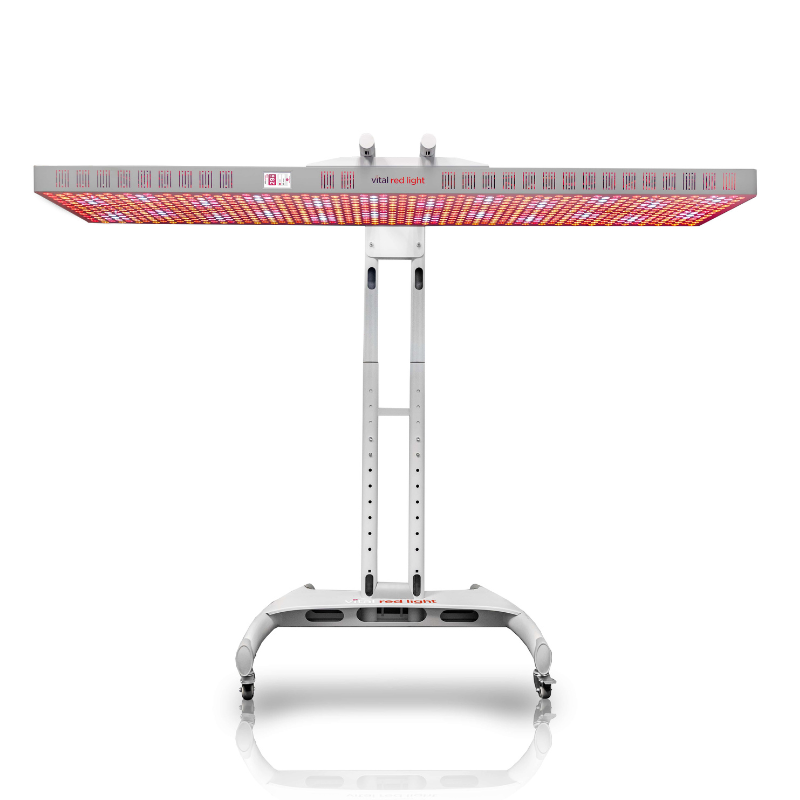 LED red light device on a stand with a white background